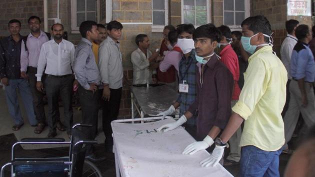 Twenty-two people were killed and 39 others were injured after a stampede broke out on a crowded pedestrian bridge connecting two stations in Mumbai on Friday, one of the worst tragedies to hit the city’s teeming local train network.(Bhushan Koyande/HT)