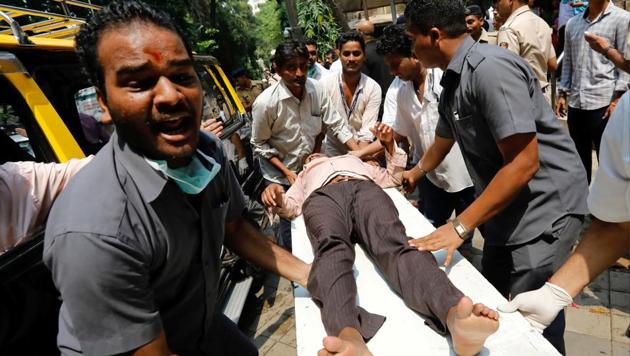 A stampede victim is carried on a stretcher at a hospital in Mumbai, India September 29.(REUTERS)