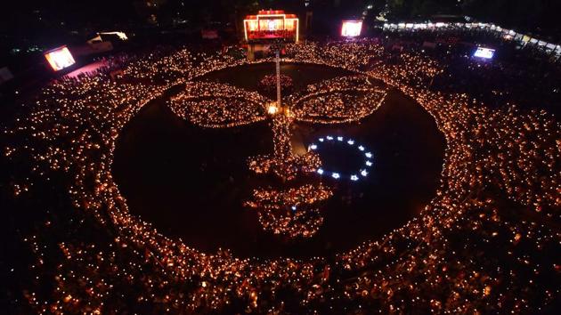 The face of the deity Amba formed by Indian performers and devotees holding candles during the Navratri festival at the Gandhinagar Cultural Forum venue in Gandhinagar, Gujarat, India on September 28, 2017. (Gandhinagar Cultural Forum / AFP) The face of the deity Amba formed by Indian performers and devotees holding candles during the Navratri festival at the Gandhinagar Cultural Forum venue in Gandhinagar, Gujarat, India on September 28, 2017. (Gandhinagar Cultural Forum / AFP)
