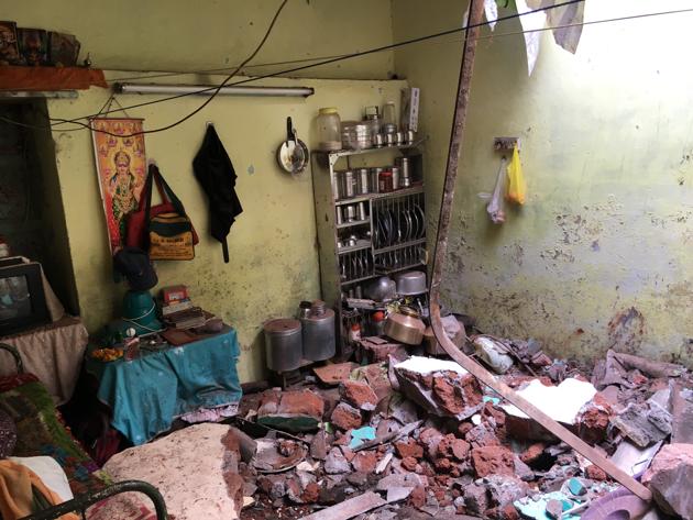 The victims lived in an asbestos covered structure separated from the two-storeyed building undergoing reconstruction by a narrow lane. (HT Photo)