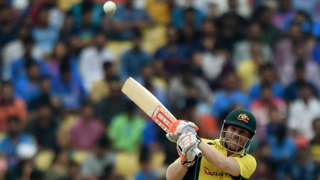 Australian cricketer David Warner plays a shot en route to his half-century during the fifth one-day international match against India at the Vidarbha Cricket Association Stadium in Nagpur.(AFP)