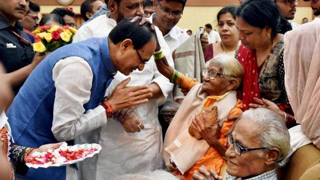 Madhya Pradesh chief minister Shivraj Singh Chouhan felicitating senior citizens at a programme to mark the International Day of Older Persons, in Bhopal on Sunday. (PTI) Madhya Pradesh chief minister Shivraj Singh Chouhan felicitating senior citizens at a programme to mark the International Day of Older Persons, in Bhopal on Sunday. (PTI)