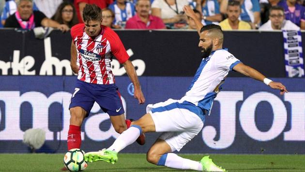 Atletico Madrid's Luciano Vietto in action with Leganes' Dimitrios Siovas. The game ended 0-0. (REUTERS) Atletico Madrid's Luciano Vietto in action with Leganes' Dimitrios Siovas. The game ended 0-0. (REUTERS)