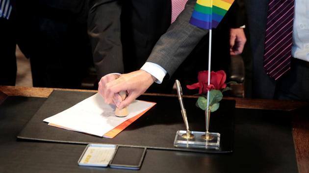 Same-sex couple Karl Kreil and Bodo Mende get married at a registry office, becoming Germany's first married gay couple after German parliament approved marriage equality in a historic vote this past summer, in Berlin, Germany October 1.(Reuters Photro)