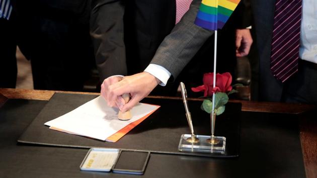 Same-sex couple Karl Kreil and Bodo Mende get married at a registry office, becoming Germany's first married gay couple after German parliament approved marriage equality in a historic vote this past summer, in Berlin, Germany October 1. (Reuters Photro)