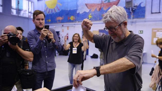 A man raises his fist as he casts his ballot in a polling station in Barcelona. (AFP Photo) A man raises his fist as he casts his ballot in a polling station in Barcelona. (AFP Photo)