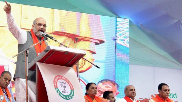 BJP president Amit Shah addresses a function to kick off the Gujarat Gaurav Yatra for the forthcoming assembly polls in Anand on Sunday.(PTI Photo) BJP president Amit Shah addresses a function to kick off the Gujarat Gaurav Yatra for the forthcoming assembly polls in Anand on Sunday.(PTI Photo)