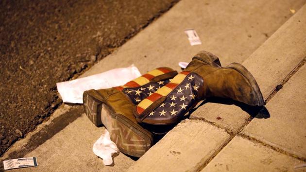 A pair of cowboy boots is shown in the street outside the concert venue in Las Vegas, Nevada. (Steve Marcus / REUTERS) A pair of cowboy boots is shown in the street outside the concert venue in Las Vegas, Nevada. (Steve Marcus / REUTERS)