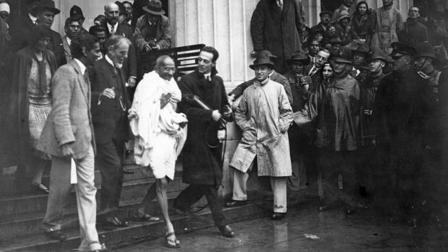 Gandhi is seen leaving Friends’ Meeting House, Euston Road, London, after attending the Round Table Conference on Indian constitutional reforms. (Douglas Miller / Getty Images)