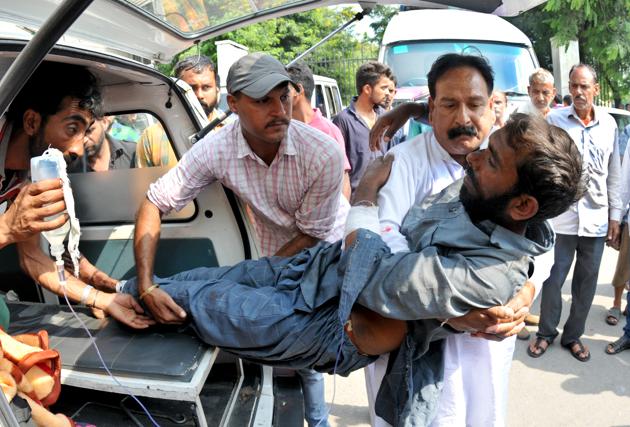 An injured being shifted to a government medical college for a treatment in Jammu on Monday. Two children were killed and 12 villagers injured as Pakistan targeted Indian villages and posts with heavy gunfire and mortar shells along the line of control (LoC) in Jammu and Kashmir’s Poonch district on Monday.(Nitin Kanotra/HT Photo)