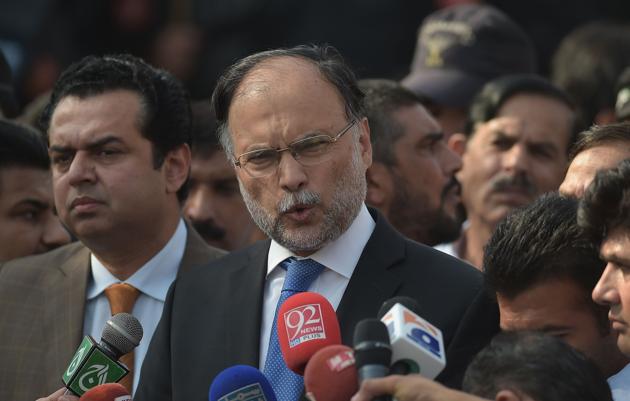 Pakistani interior minister Ahsan Iqbal speaks to media outside an accountability court in Islamabad on October 2, 2017. (AFP)