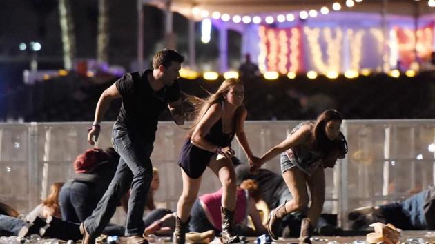 People run from the Route 91 Harvest country music festival after gunfire was hear on October 1, 2017. (AFP) People run from the Route 91 Harvest country music festival after gunfire was hear on October 1, 2017. (AFP)