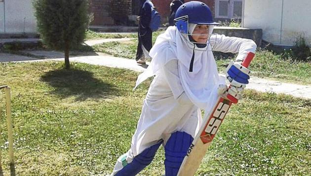 Well defended! A woman cricketer in Baramulla defying social restrictions in her passion for the sport. (PTI) Well defended! A woman cricketer in Baramulla defying social restrictions in her passion for the sport. (PTI)