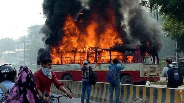 BSP workers torched a roadways bus on Tuesday. (HT Photo)
