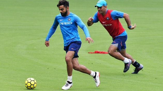 Indian cricket team captain Virat Kohli (L) and teammate MS Dhoni play football during a practice session. Kohli has wished good luck to the Indian FIFA U-17 World Cup squad. (AFP) Indian cricket team captain Virat Kohli (L) and teammate MS Dhoni play football during a practice session. Kohli has wished good luck to the Indian FIFA U-17 World Cup squad. (AFP)