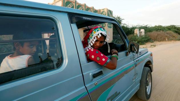 Gulaban, seen driving her family, has stolen the march on her fellow trainees because she was the only woman who knew how to drive a car before training to be a truck driver.  She continues to be an inspiration to women who hope to empower themselves through driving.  (Akhtar Soomro / REUTERS) 