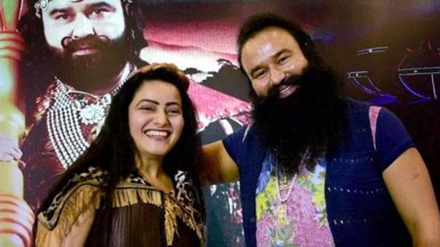 Honeypreet Insan with jailed Dera Sacha Sauda chief Gurmeet Ram Rahim Singh. Honeypreet denied she had ever left the country or that her adopted father abused her sexually.(PTI file photo)