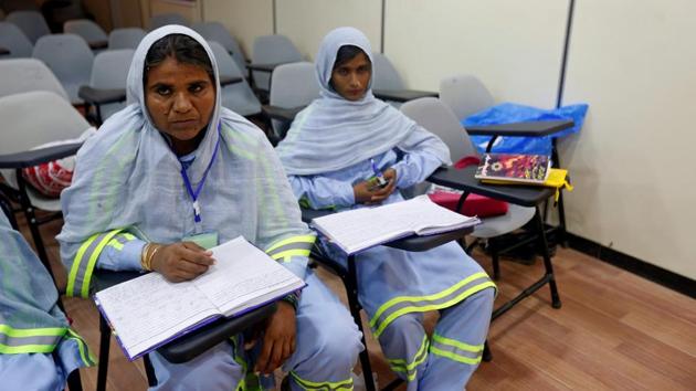 Women listen to the instructor during a training session of the ‘Female Dump Truck Driver Programme’ held by the Sindh Engro Coal Mining Company (SECMC) in Islamkot, Tharparkar, Pakistan. (Akhtar Soomro / REUTERS)