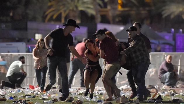 People carry a person at the Route 91 Harvest country music festival after gun fire in Las Vegas, Nevada. (AFP Photo) People carry a person at the Route 91 Harvest country music festival after gun fire in Las Vegas, Nevada. (AFP Photo)