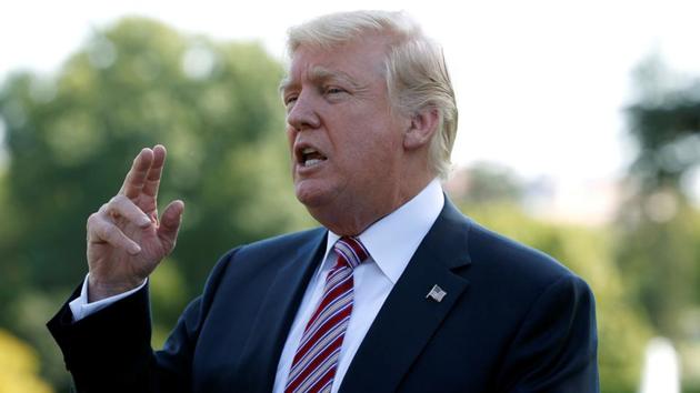 US President Donald Trump speaks to reporters as he departs for Bedminster, New Jersey, from the White House in Washington, US, September 29, 2017. (REUTERS)