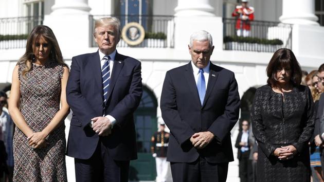 President Donald Trump and first lady Melania Trump stand with vice president Mike Pence and his wife Karen during a moment of silence to remember the victims of the mass shooting in Las Vegas, on the South Lawn of the White House in Washington, Monday, October 2, 2017. (AP Photo) President Donald Trump and first lady Melania Trump stand with vice president Mike Pence and his wife Karen during a moment of silence to remember the victims of the mass shooting in Las Vegas, on the South Lawn of the White House in Washington, Monday, October 2, 2017. (AP Photo)