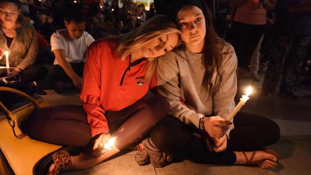 At the vigil were friends of the victims alongwith some survivors themselves. People attending the country music concert described scenes of horror as they realized that what they first thought were fireworks were actually gunshots. (Robyn Beck / AFP)