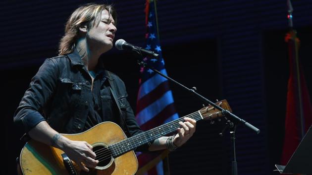 Singer-songwriter Keith Urban performed ‘Bridge Over Troubled Waters’ during the Nashville candelight vigil for Las Vegas victims at the Ascend Amphitheatre in Nashville, Tennessee. (Rick Diamond / AFP)