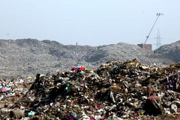 Earlier this year, the BMC issued a Letter of Intent to the contractor to start the process of land reclamation at the Mulund dumpyard, which is spread over 24 hectares.(HT PHOTO)