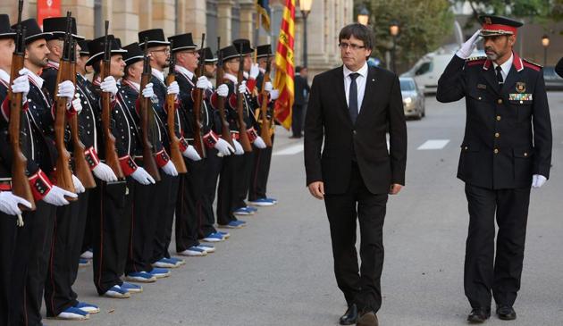 President of the Catalan regional government Carles Puigdemont (2R) and Josep Lluis Trapero (R), chief of the Catalan regional police on September 10. (AFP File Photo) President of the Catalan regional government Carles Puigdemont (2R) and Josep Lluis Trapero (R), chief of the Catalan regional police on September 10. (AFP File Photo)