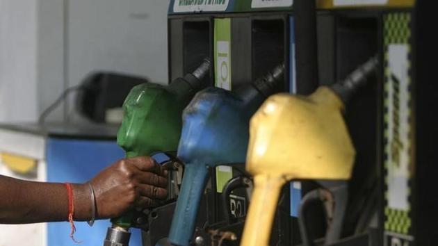 An attendant lifts a petrol nozzle at a petrol pump in Siliguri. (Reuters File Photo) An attendant lifts a petrol nozzle at a petrol pump in Siliguri. (Reuters File Photo)