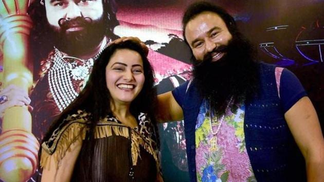 Honeypreet Insan is seen with Gurmeet Ram Rahim Singh at the promotion of the film ‘‘MSG - The Warrior Lion Heart’’ in Bengaluru. (PTI File Photo) Honeypreet Insan is seen with Gurmeet Ram Rahim Singh at the promotion of the film ‘‘MSG - The Warrior Lion Heart’’ in Bengaluru. (PTI File Photo)