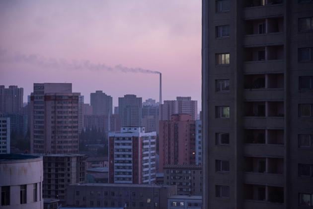 Smoke billows from a power station behind the skyline of Pyongyang on September 21, 2017. (AFP)