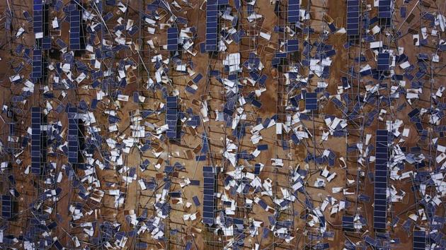 Solar panel debris is seen scattered in a solar panel field in the aftermath of Hurricane Maria in Humacao, Puerto Rico. (Ricardo Arduengo / AFP)