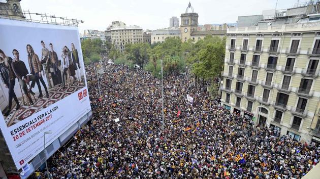 Protesters gather at the Placa de la Universitat square in Barcelona during a general strike called by Catalan unions. (Pierre-Philippe Marcou / AFP) Protesters gather at the Placa de la Universitat square in Barcelona during a general strike called by Catalan unions. (Pierre-Philippe Marcou / AFP)