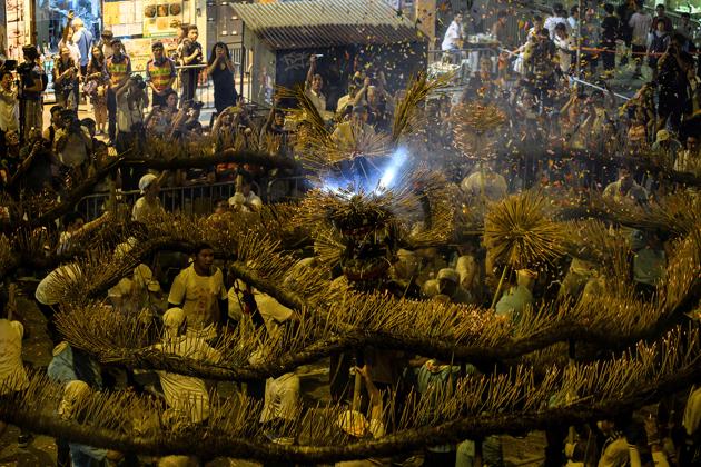 Participants take part in the annual Tai Hang “fire dragon” event, one of the highlights of the city’s mid-autumn festival, in Hong Kong. (AFP) Participants take part in the annual Tai Hang “fire dragon” event, one of the highlights of the city’s mid-autumn festival, in Hong Kong. (AFP)