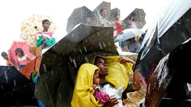 File photo of Rohingya refugees waiting for aid packages during rain in Cox's Bazar, Bangladesh, on September 17, 2017. (Reuters) File photo of Rohingya refugees waiting for aid packages during rain in Cox's Bazar, Bangladesh, on September 17, 2017. (Reuters)