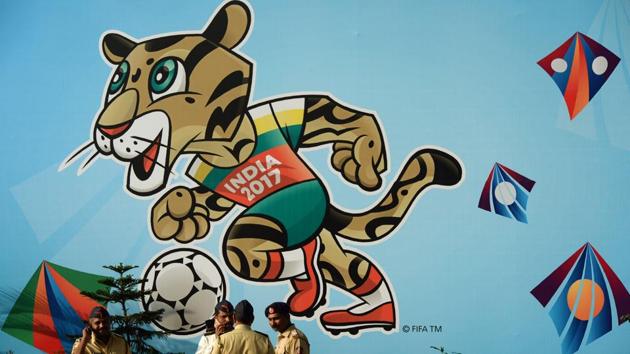 Policemen stand near the poster of FIFA U-17 World Cup mascot at the DY Patil Stadium in Navi Mumbai on Thursday. (AFP) Policemen stand near the poster of FIFA U-17 World Cup mascot at the DY Patil Stadium in Navi Mumbai on Thursday. (AFP)