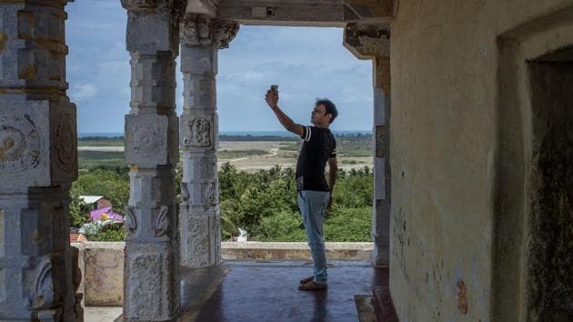Selfies have made their way even to Gandamadana Parvatham, also known as Rama’s Foot because it is said to bear the imprint of Lord Rama in Rameswaram on Pamban Island.The improved access has brought in waves of tourists while the previous spartan accommodation in ashrams has made way for a Hyatt hotel and large touring groups. (Atul Loke / NYT)