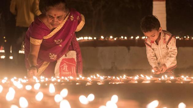 A child seems to be learning from an elderly woman. (Aalok  Soni/HT PHOTO) 