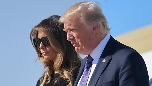 US President Donald Trump and First Lady Melania Trump step off Air Force One upon arrival at McCarran International Airport in Las Vegas on October 4, 2017. President Donald Trump arrived Wednesday in Las Vegas, where he will meet survivors of the most deadly mass shooting in modern US history.(AFP Photo)