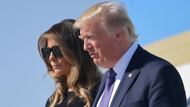 US President Donald Trump and First Lady Melania Trump step off Air Force One upon arrival at McCarran International Airport in Las Vegas on October 4, 2017. President Donald Trump arrived Wednesday in Las Vegas, where he will meet survivors of the most deadly mass shooting in modern US history. (AFP Photo) US President Donald Trump and First Lady Melania Trump step off Air Force One upon arrival at McCarran International Airport in Las Vegas on October 4, 2017. President Donald Trump arrived Wednesday in Las Vegas, where he will meet survivors of the most deadly mass shooting in modern US history. (AFP Photo)