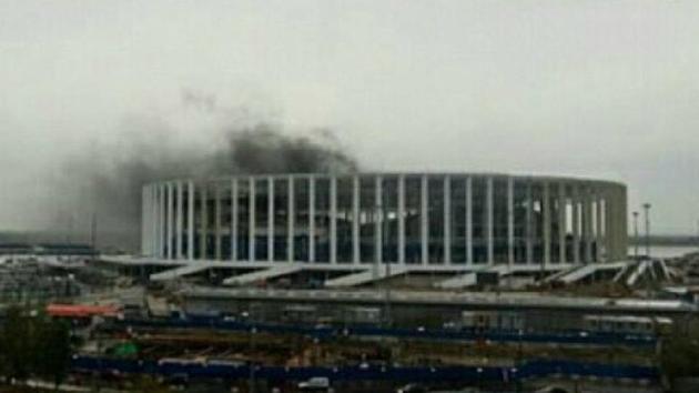 Pictures and video footage of the fire at Novgorod Stadium in Nizhny Novgorod, a venue of the 2018 FIFA World Cup in Russia, showed thick smoke from the stadium, scheduled to be completed by the end of the year. (Twitter) Pictures and video footage of the fire at Novgorod Stadium in Nizhny Novgorod, a venue of the 2018 FIFA World Cup in Russia, showed thick smoke from the stadium, scheduled to be completed by the end of the year. (Twitter)