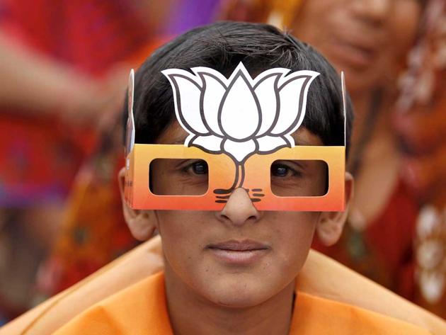 A boy wearing paper goggles featuring the Bharatiya Janata Party’s symbol.(Representative picture/Reuters Photo.)