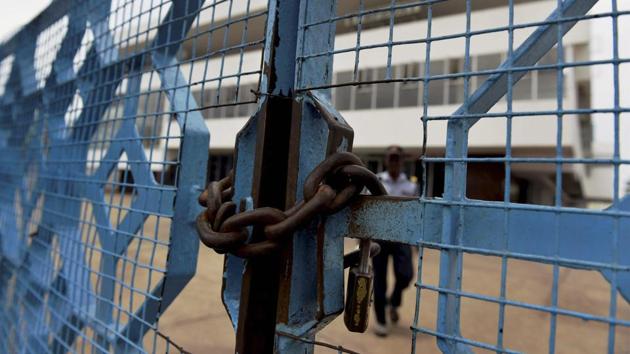 A security person at a deserted cinema in Chennai (PTI File Photo) A security person at a deserted cinema in Chennai (PTI File Photo)