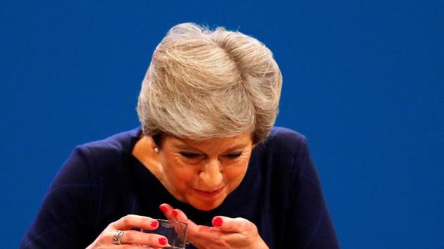 Britain's Prime Minister Theresa May struggles with water after she suffered a coughing fit whilst addressing the Conservative Party conference in Manchester on October 4, 2017. (Reuters) Britain's Prime Minister Theresa May struggles with water after she suffered a coughing fit whilst addressing the Conservative Party conference in Manchester on October 4, 2017. (Reuters)