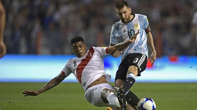 Argentina national football team's Lionel Messi (R) gets tackled by Peru national football team's Wilder Cartagena during their FIFA World Cup 2018 qualifier match in Buenos Aires on Thursday. (AFP) Argentina national football team's Lionel Messi (R) gets tackled by Peru national football team's Wilder Cartagena during their FIFA World Cup 2018 qualifier match in Buenos Aires on Thursday. (AFP)