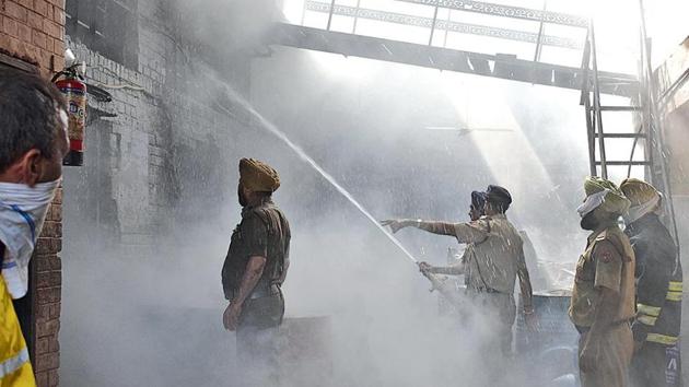 Firemen trying to douse flames at the Devdarshan Dhoop factory in the Industrial Area, Phase 2, Chandigarh on Friday. (Sikander Singh/HT) Firemen trying to douse flames at the Devdarshan Dhoop factory in the Industrial Area, Phase 2, Chandigarh on Friday. (Sikander Singh/HT)