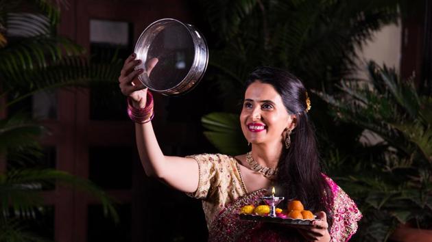 On this day, married women fast until moonrise. They offer their prayers to the moon, before ending the fast. (Shutterstock) On this day, married women fast until moonrise. They offer their prayers to the moon, before ending the fast. (Shutterstock)