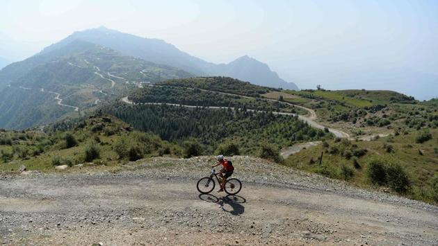 A mountain biker competes in the Hero MTB Himalaya mountain bike race near Barot village in the northern Indian state of Himachal Pradesh. The 13th edition of the annual cross country race took place over eight stages in the foothills of the Himalayas. (AFP / SAJJAD HUSSAIN) A mountain biker competes in the Hero MTB Himalaya mountain bike race near Barot village in the northern Indian state of Himachal Pradesh. The 13th edition of the annual cross country race took place over eight stages in the foothills of the Himalayas. (AFP / SAJJAD HUSSAIN)