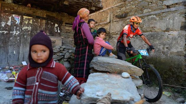Much to the villagers’ amusement, India’s Sunil Barongpa is seen riding through a residential lane in a village in Kangra, Himachal Pradesh. (AFP / SAJJAD HUSSAIN) Much to the villagers’ amusement, India’s Sunil Barongpa is seen riding through a residential lane in a village in Kangra, Himachal Pradesh. (AFP / SAJJAD HUSSAIN)